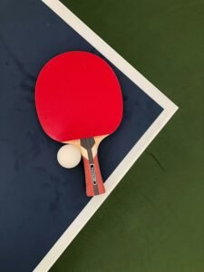 ping pong table with racket and ball